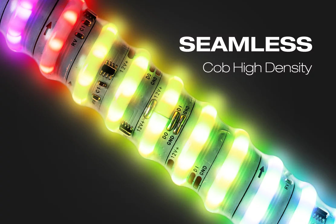A close-up of a high-density RGB LED strip light showing multiple glowing color channels including red, green, yellow, and blue against a dark background, with the text 'SEAMLESS Cob High Density' on the right.
