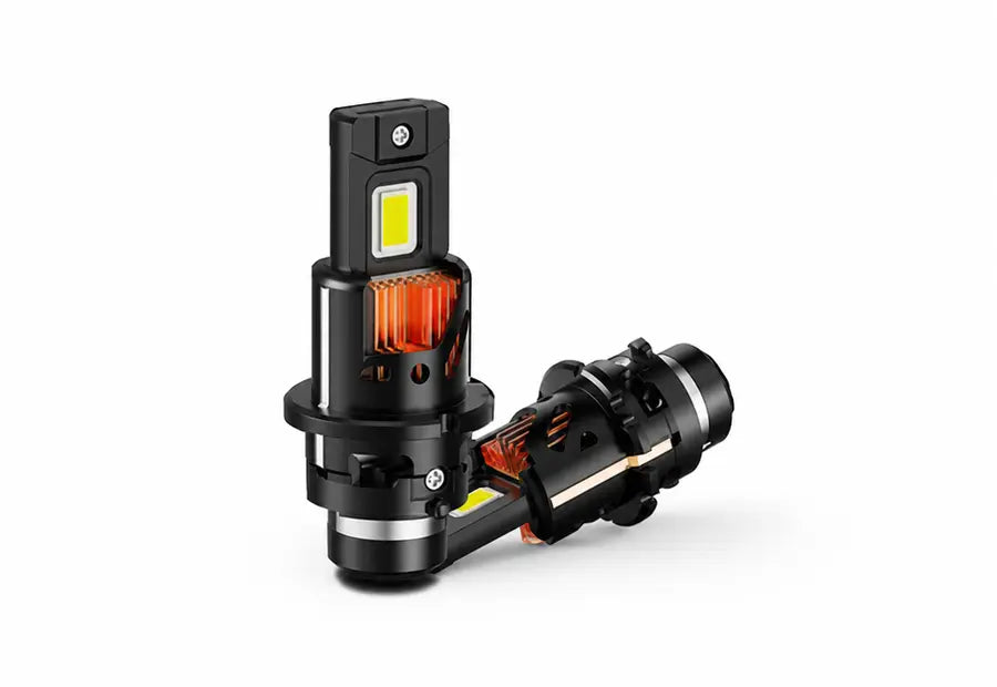 A pair of black LED car headlights, one shown from a direct front view and the other from a side angle, displaying the internal copper heat sink and orange reflector, on a clean white background.